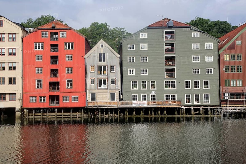 Historic waterside warehouse buildings on River Nidelva, Bryggene, Trondheim, Norway, Europe