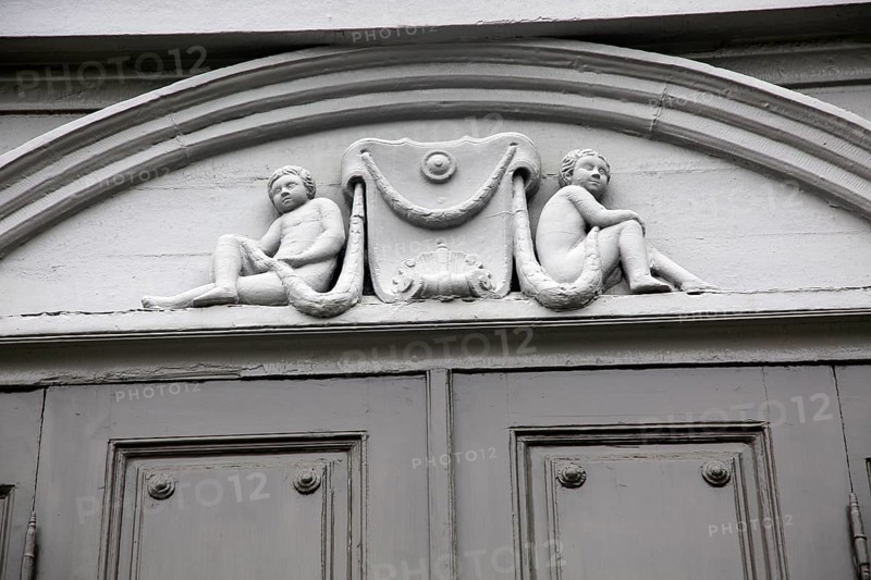 Details of cherub carvings, Stiftsgarden palace in city of Trondheim, Norway, Europe