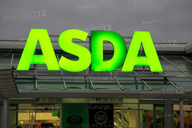 Asda superstore sign lit up at night, Falmouth, Cornwall, UK