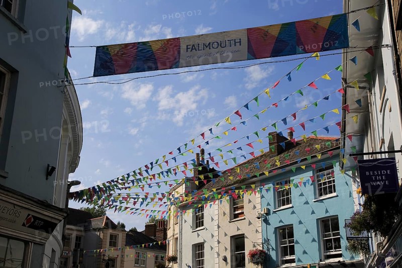Bunting flags flying in street of town centre, Falmouth, Cornwall, England, UK