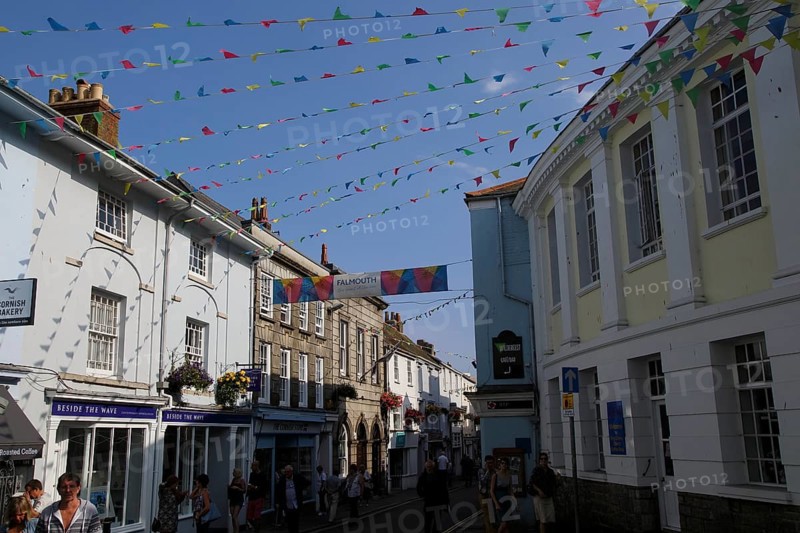 Bunting flags flying in street of town centre, Falmouth, Cornwall, England, UK