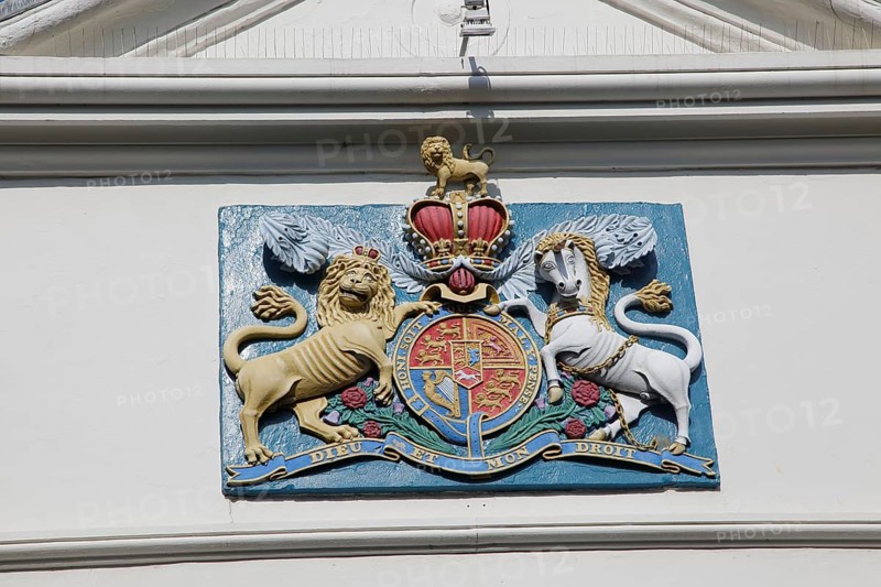 Lion and unicorn royal coat of arms 'Dieu et mon Droit' motto of monarchy seen in Falmouth, Cornwall, England, UK