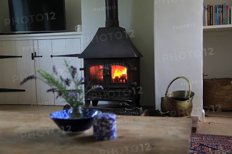 Domestic stove warm coal fire in domestic home, UK