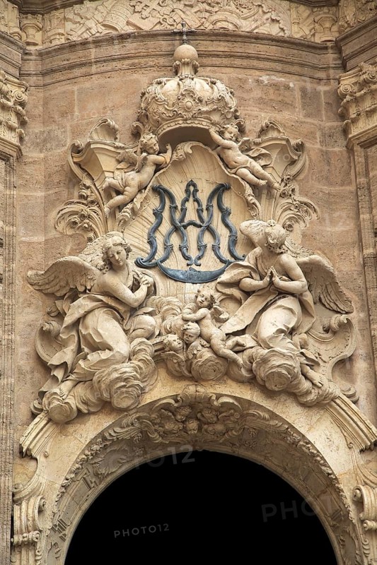 Ornately carved decorated stonework above the entrance to the cathedral church in city of Valencia, Spain, Europe