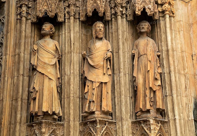 Statues of Christian saints carved stonework of the cathedral church in city of Valencia, Spain, Europe