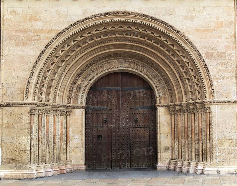 Arched doorway of the cathedral church building in city of Valencia, Spain, Europe