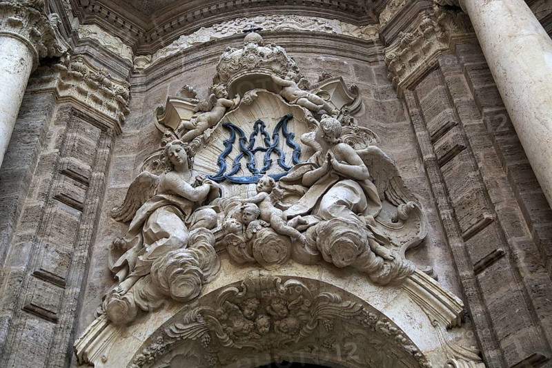 Ornately carved decorated stonework above the entrance to the cathedral church in city of Valencia, Spain, Europe