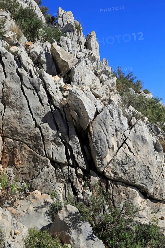 Joints and bedding planes in weathered carboniferous rock, near Tarbena, Marina Alta, Alicante province, Spain, Europe