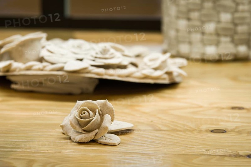Closeup of rose patterns beige dough sculpture, Teig, gebacken