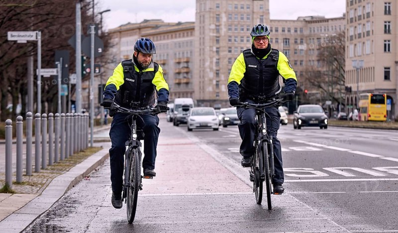 Employees of the bicycle squadron of the public order office with their bikes on a street. The bicycle squadron of the public order office in Mitte has a fleet of 20 bicycles at its disposal, Berlin, 22/01/2024