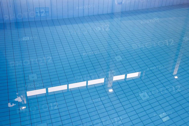 Lamps reflected in the swimming pool of the reopened Tiergarten municipal swimming pool, Berlin, 22/01/2024
