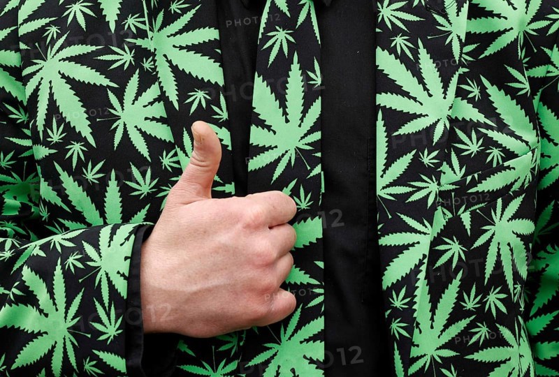 Berlin, 20.04.2020, A demonstrator wears a tie and suit with a canabis pattern for legal marijuana use. The demonstrators are calling for the legalisation and immediate decriminalisation of cannabis users in Germany