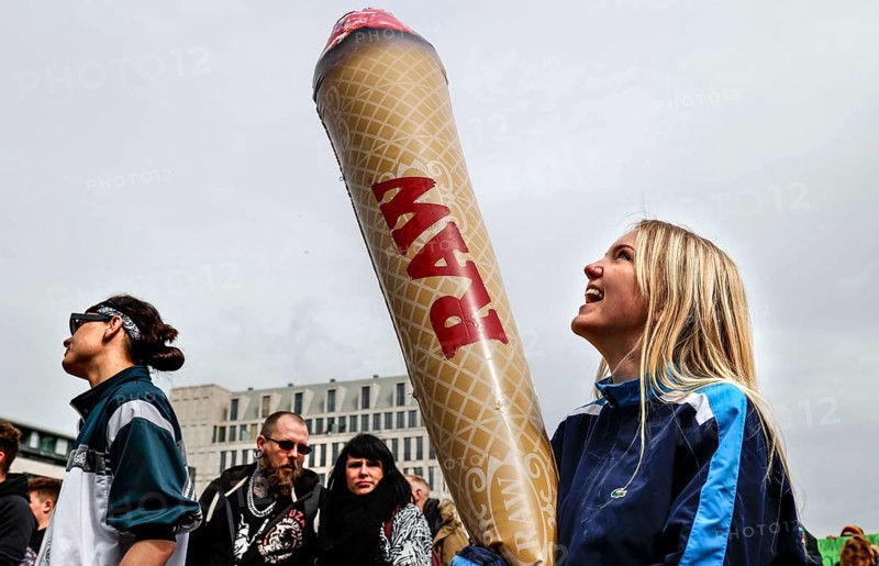 A woman holds a model of a giant joint during a demonstration in favour of legal marijuana use. The demonstrators call for the legalisation and immediate decriminalisation of cannabis users in Germany, Berlin, 20.04.2020
