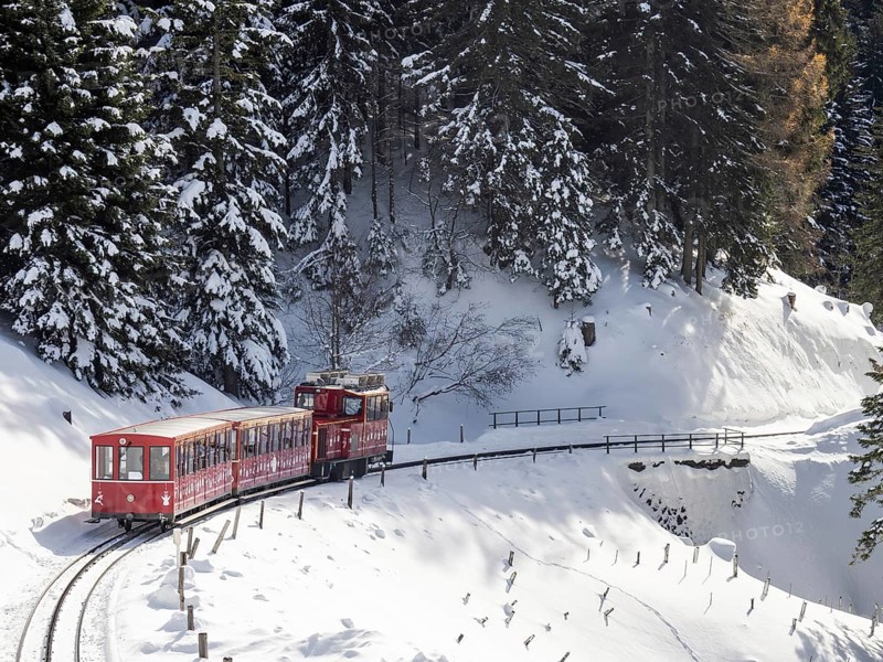 Winter landscape, Schafberg cog railway decorated for Christmas travelling up to the Schafbergalm, St.Wolfgang, Salzkammergut, Upper Austria, Austria, Europe