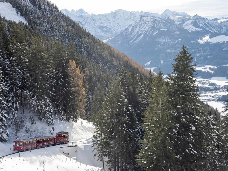 Winter landscape, Schafberg cog railway decorated for Christmas travelling up to the Schafbergalm, St.Wolfgang, Salzkammergut, Upper Austria, Austria, Europe