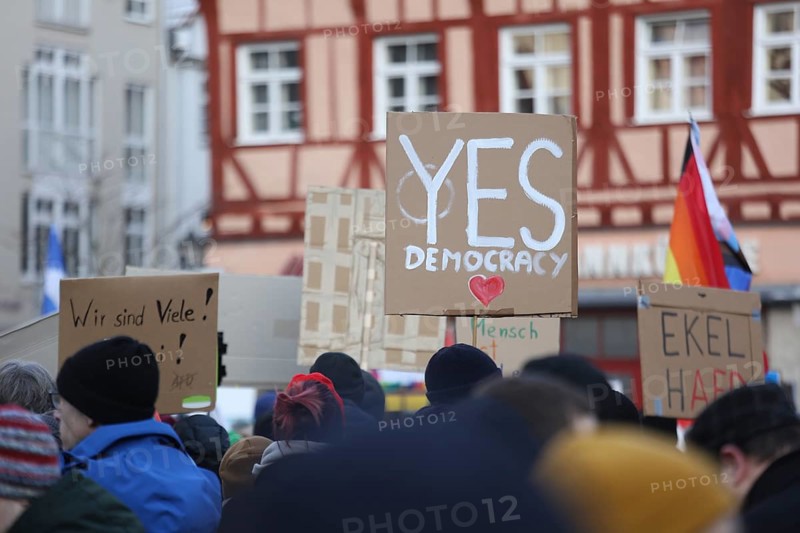 A Yes Democracy placard held high by a member of the crowd during a demonstration against the AFD last Sunday. Coburg, Germany, Europe