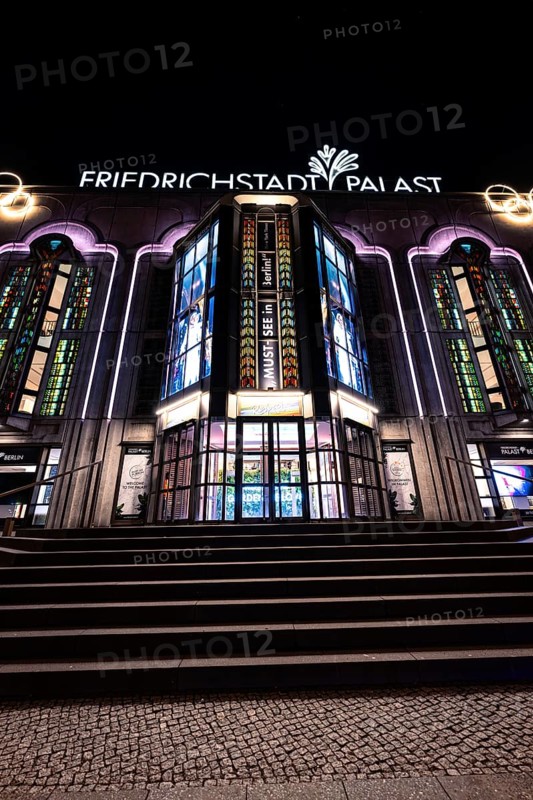Night view of the illuminated Friedrichstadt-Palast with its characteristic façade and windows, Berlin, Germany, Europe