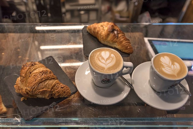 Two cappuccinos and two croissants in a café, Genoa, Italy, Europe