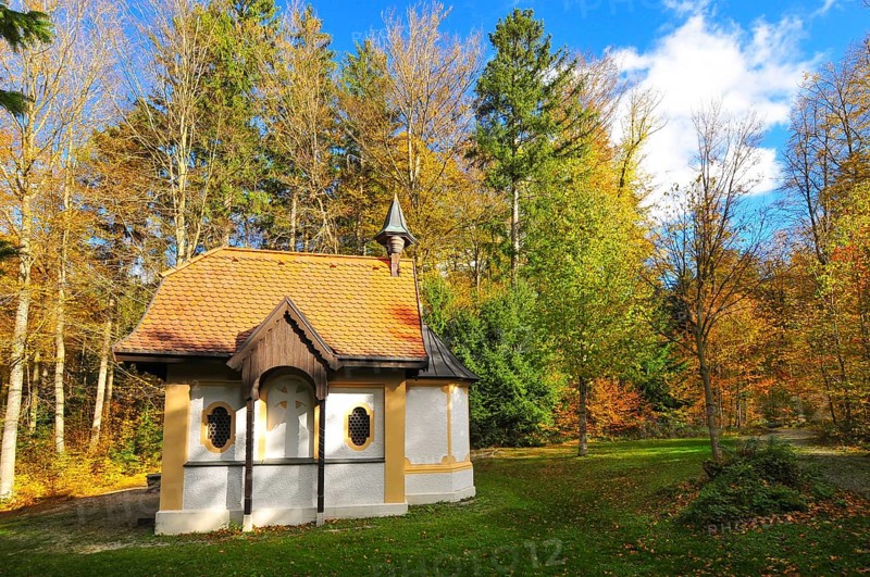 Hubertus Chapel in autumn-coloured forest near Oberschönenfeld in the Augsburg Western Forests nature park Park, Bavaria, Germany, Europe