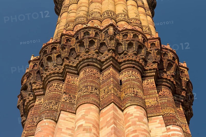 Qutb Minar, the minaret and victory tower, one of the UNESCO World Heritage Sites in Delhi, photographed on a clear, blue-sky, October day. Detailed decoration, Arabic inscription. Qutb Minar complex, Mehrauli, National Capital Territory of Delhi, India, Asia