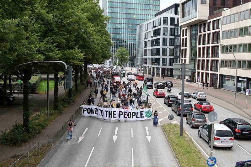 Demonstrators hold a banner with the inscription Power to the people at the alliance demo on climate racism and climate flight, with Fridays For Future, Extinction Rebellion, Sea-Watch, Sea-Eye, Seebrücke, Omas gegen Rechts in Hamburg, Germany, among others, Europe