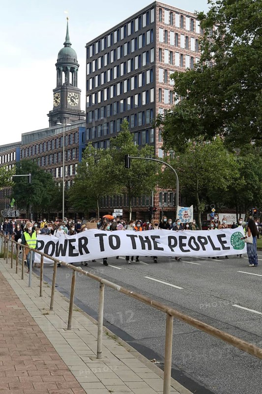 Demonstrators hold a banner with the inscription Power to the people at the alliance demo on climate racism and climate flight, with Fridays For Future, Extinction Rebellion, Sea-Watch, Sea-Eye, Seebrücke, Omas gegen Rechts in Hamburg, Germany, among others, Europe