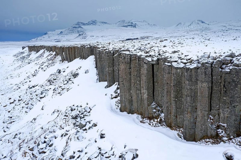 Gerðuberg, Gerduberg basalt columns in winter, cliff of dolerite in the Hnappadalur valley located on the western peninsula Snæfellsnes, Iceland, Europe