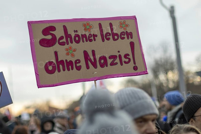 Demonstrators at the protest, Defending democracy, Together against the right, in front of the Reichstag Berlin, 21 Jan. 2024. A better life without Nazis