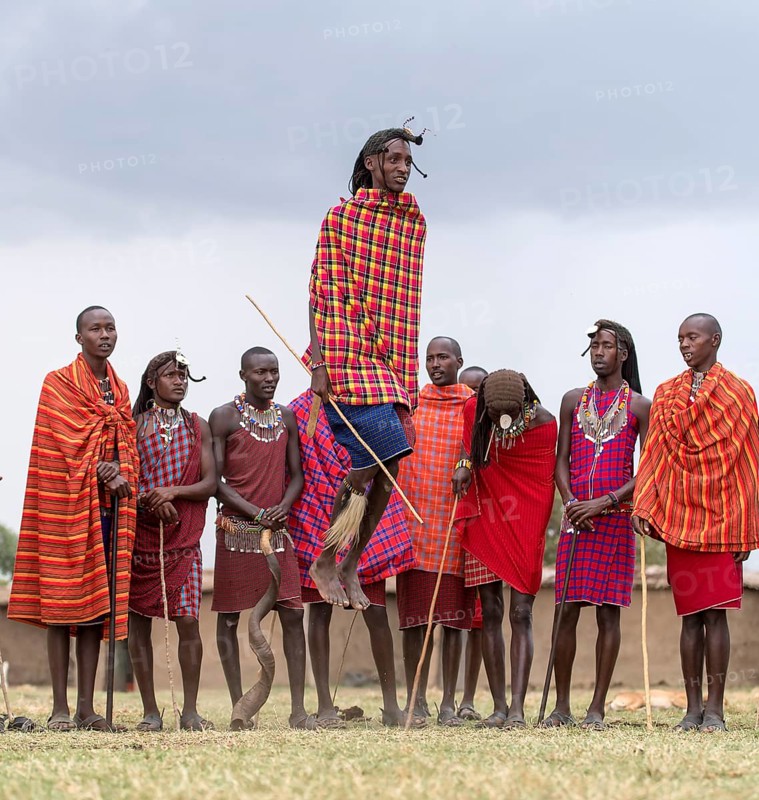 Maasai people preforming the traditional jumping dance in a Maasai village in Maasai Mara, Kenya, Africa