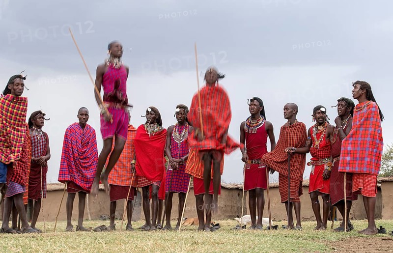 Maasai people preforming the traditional jumping dance in a Maasai village in Maasai Mara, Kenya, Africa
