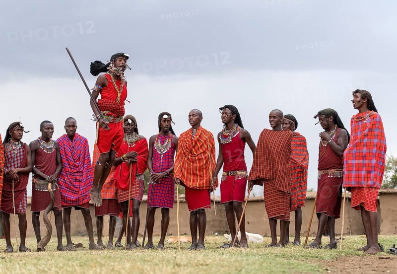 Maasai people preforming the traditional jumping dance in a Maasai village in Maasai Mara, Kenya, Africa