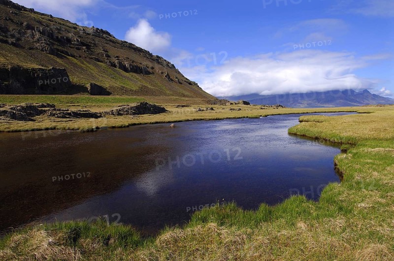 Pool or pond near the lighthouse at Streitishvarf, in the East Fjords region of eastern Iceland