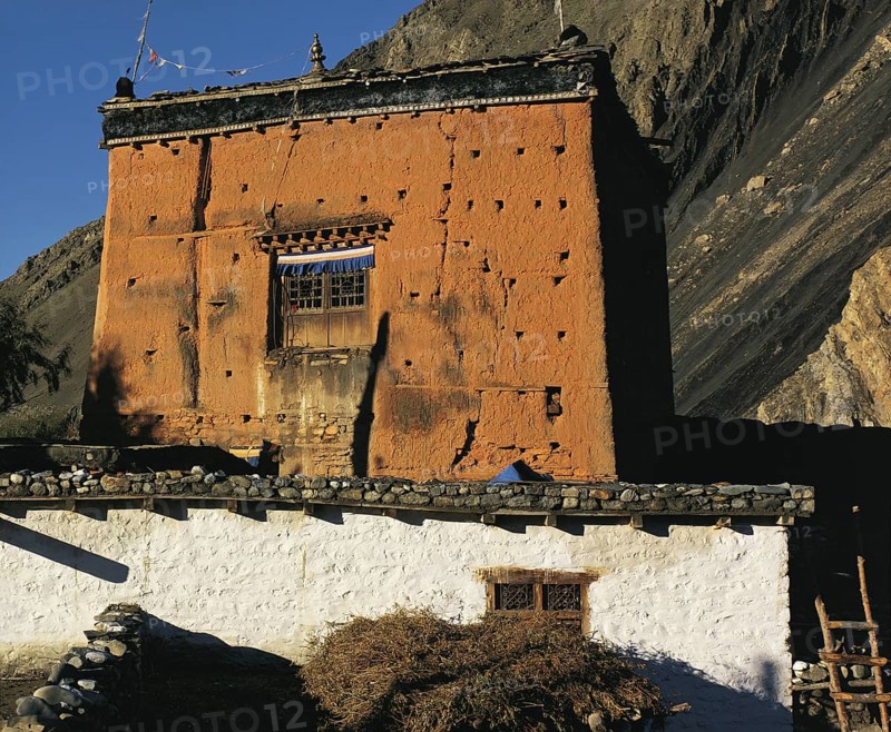 The village shrine or gompa with cliffs behind in the village of Kagbeni in southern Mustang in west Nepal