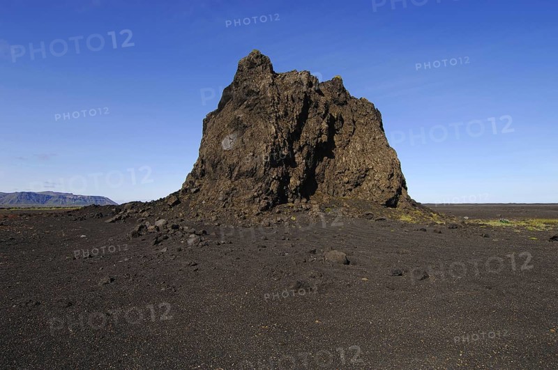 Large basalt crag or pinnacle on a cinder plain to the east of the town of Vik, southern Iceland