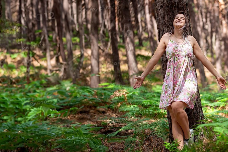 Young woman bathing in the forest (Shinrin Yoku), nature therapy from Japan