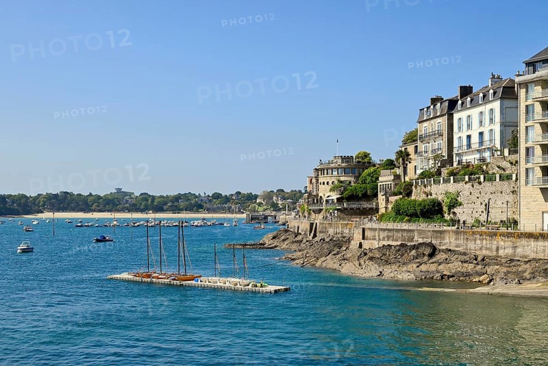Fortified coastline with buildings on the rocky shore in Dinard, Ille-et-Vilaine, Brittany, France, Europe