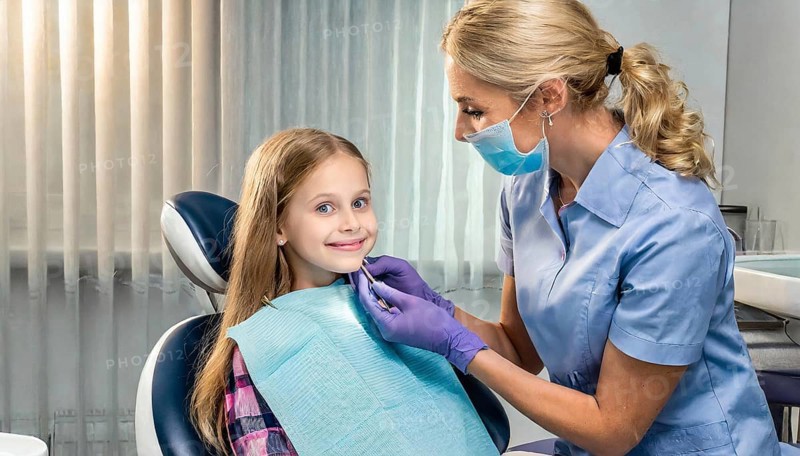 AI generated, dentist treats a little girl, dentist, blonde, 30, 35, years, dental treatment, follow-up, AI generated
