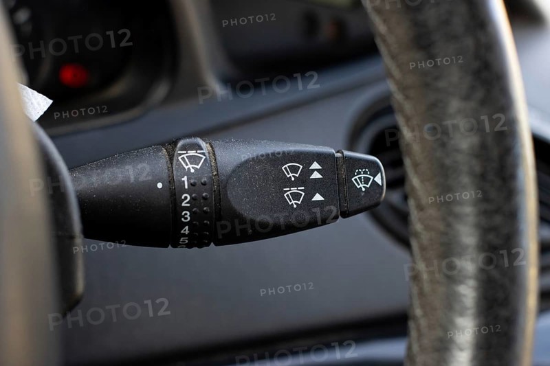Windscreen wiper control adjustment lever switch in a modern car, car interior