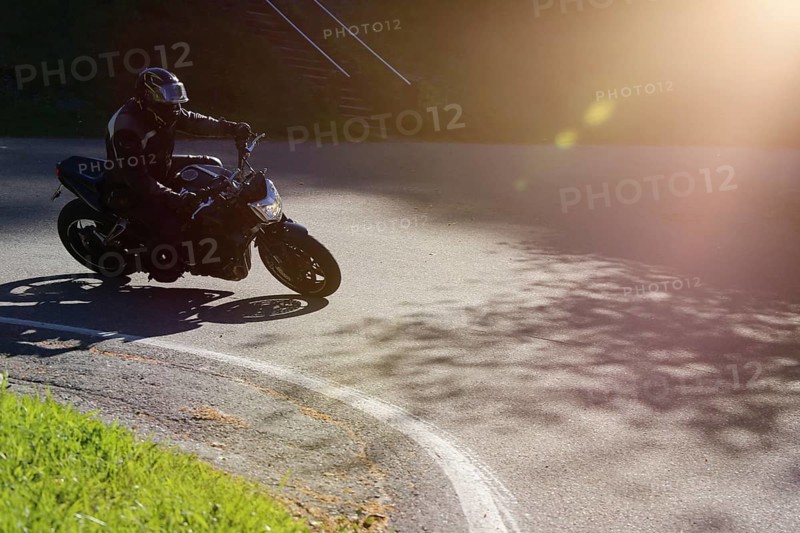 Sporty motorcyclist on a trip into the countryside (Edenkoben Valley, Palatinate Forest)