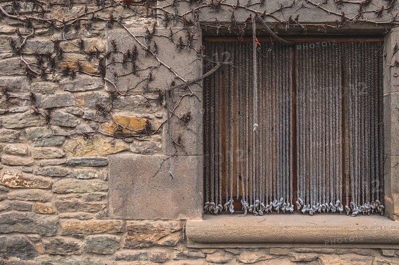 Window detail in Rupit, one of the best known medieval towns in Catalonia in Spain