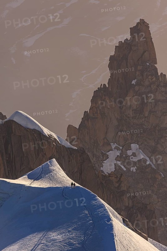 Mountaineer on glacier at sunrise, Mont Blanc Massif, French Alps, Chamonix, France, Europe