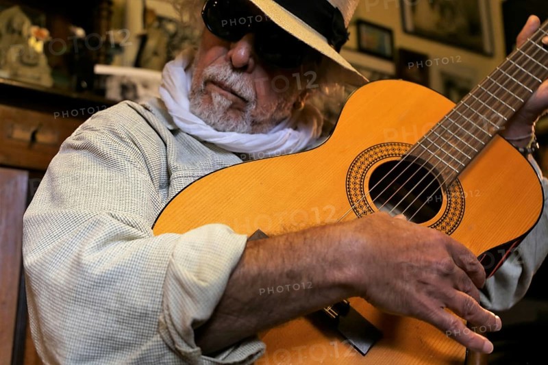 Guitar player, musician plays the guitar