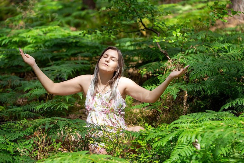 Young woman bathing in the forest (Shinrin Yoku), nature therapy from Japan