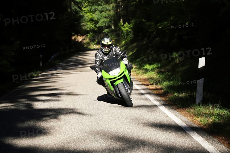 Sporty motorcyclist on a trip into the countryside (Edenkoben Valley, Palatinate Forest)