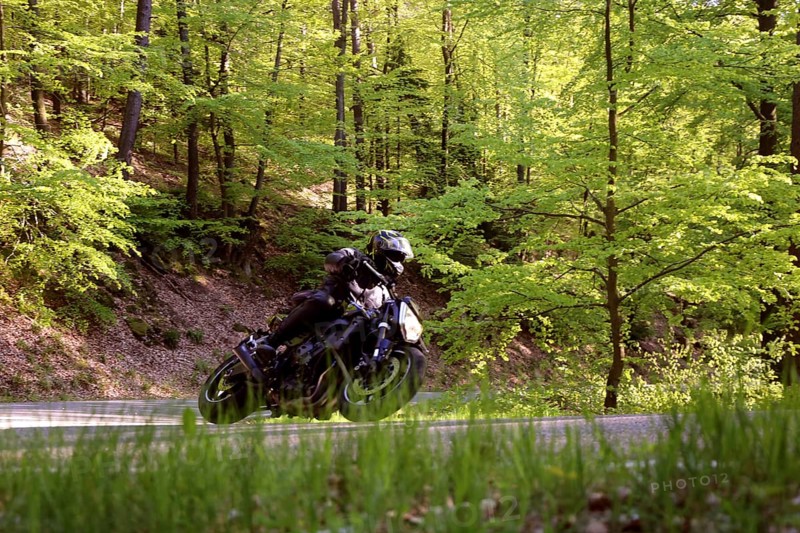 Sporty motorcyclist on a trip into the countryside (Edenkoben Valley, Palatinate Forest)