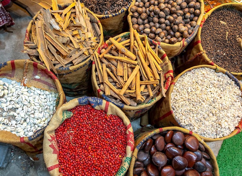A bird's-eye view of sacks with various colorful spices and herbs for sale at a market in Fort Kochi, Cochin, Kerala, India, Asia