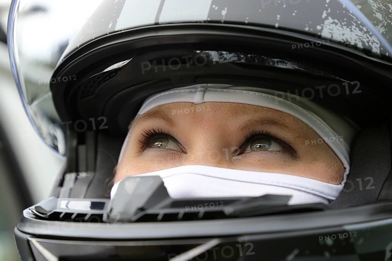 Racer with helmet and balaclava