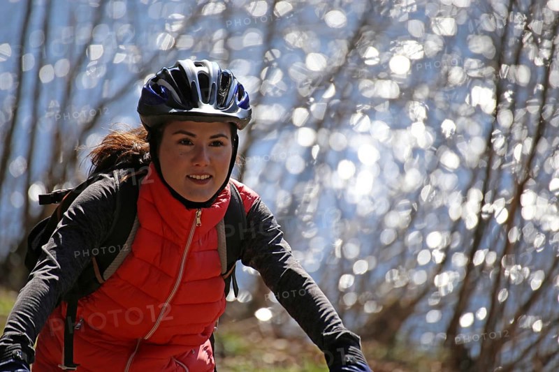 Close-up of an attractive and sporty female mountain biker