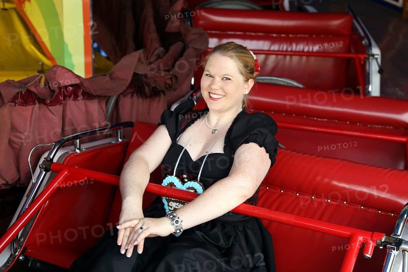 Cheerful woman travelling up and down the mountain at the Brezelfest in Speyer, Rhineland-Palatinate