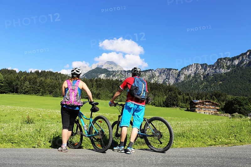 Mountain bikers enjoy the panorama from the Wilder Kaiser